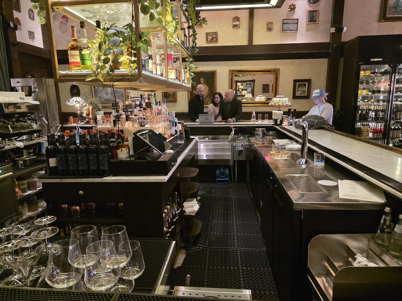 A restaurant bar and service area being set up before service
